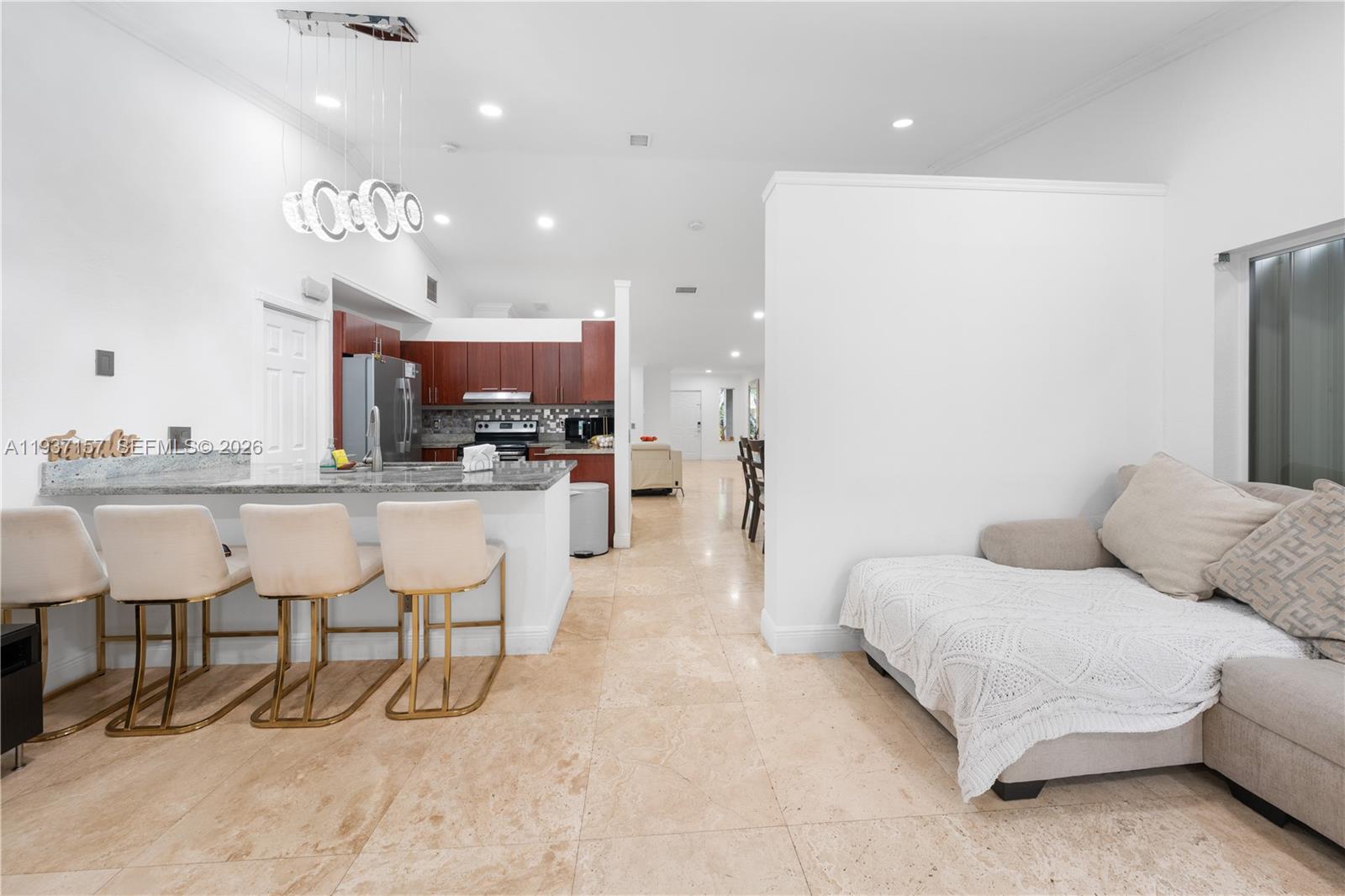 4361 Mahogany Ridge Drive Weston, FL 33331 - Photo 28 of 47 a living room with furniture and kitchen view