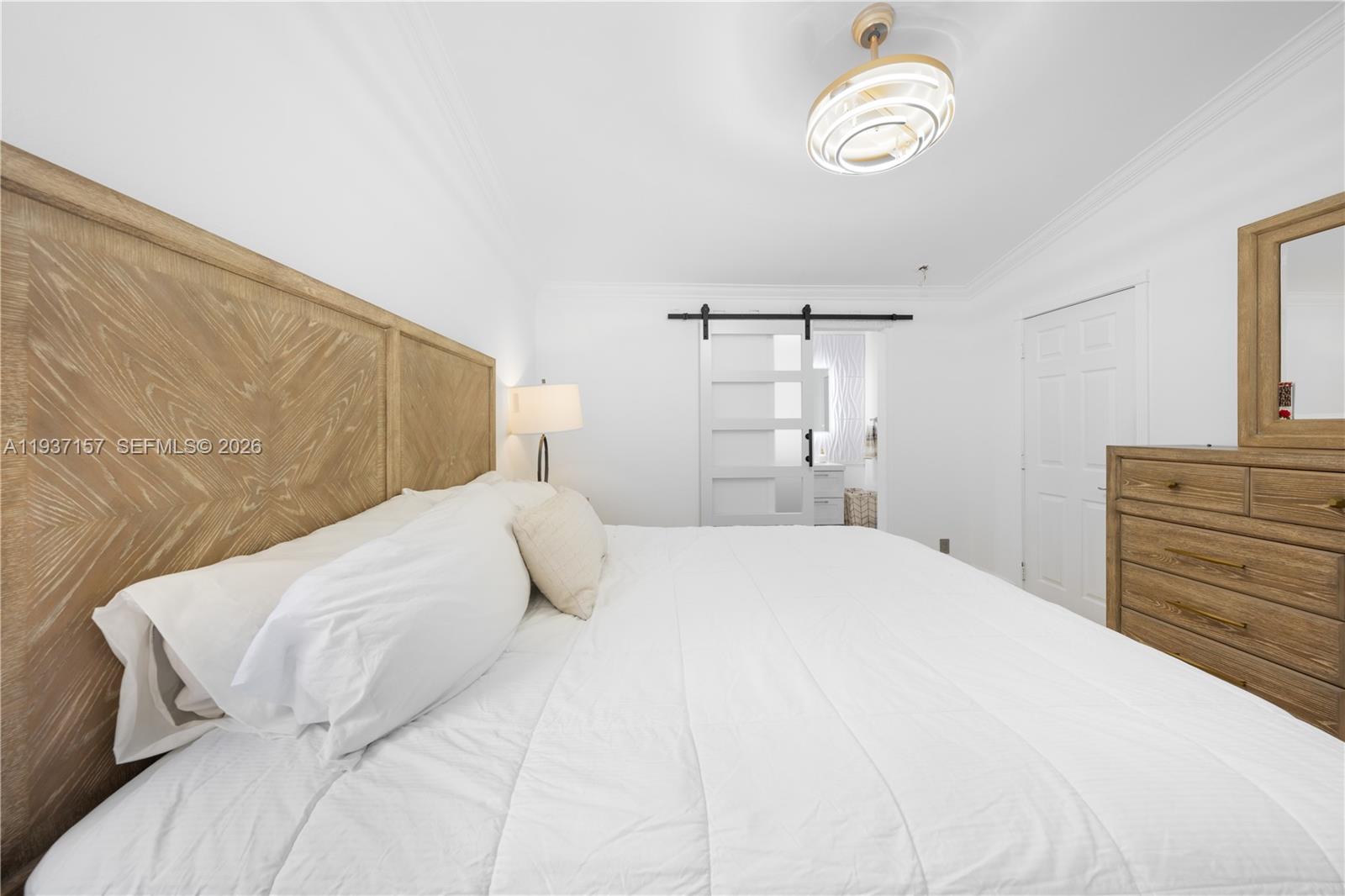 4361 Mahogany Ridge Drive Weston, FL 33331 - Photo 32 of 47 a bedroom with a bed and cabinets