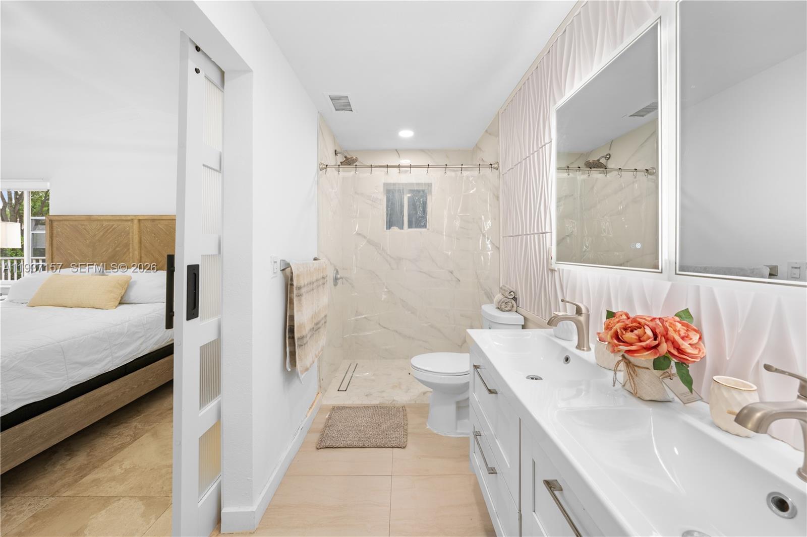 4361 Mahogany Ridge Drive Weston, FL 33331 - Photo 33 of 47 a bathroom with a sink toilet vanity and shower