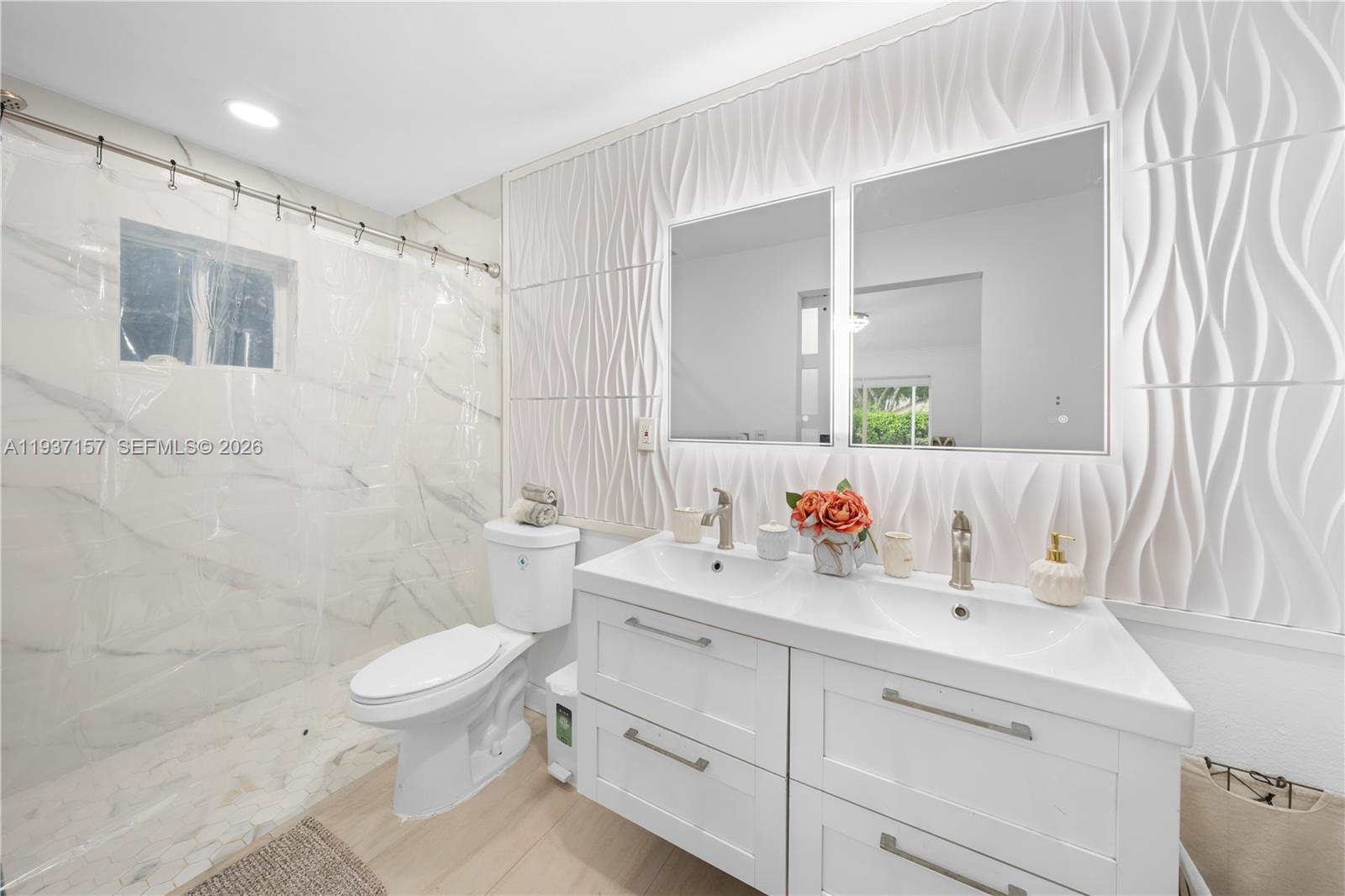 4361 Mahogany Ridge Drive Weston, FL 33331 - Photo 34 of 47 a bathroom with a sink a toilet and shower