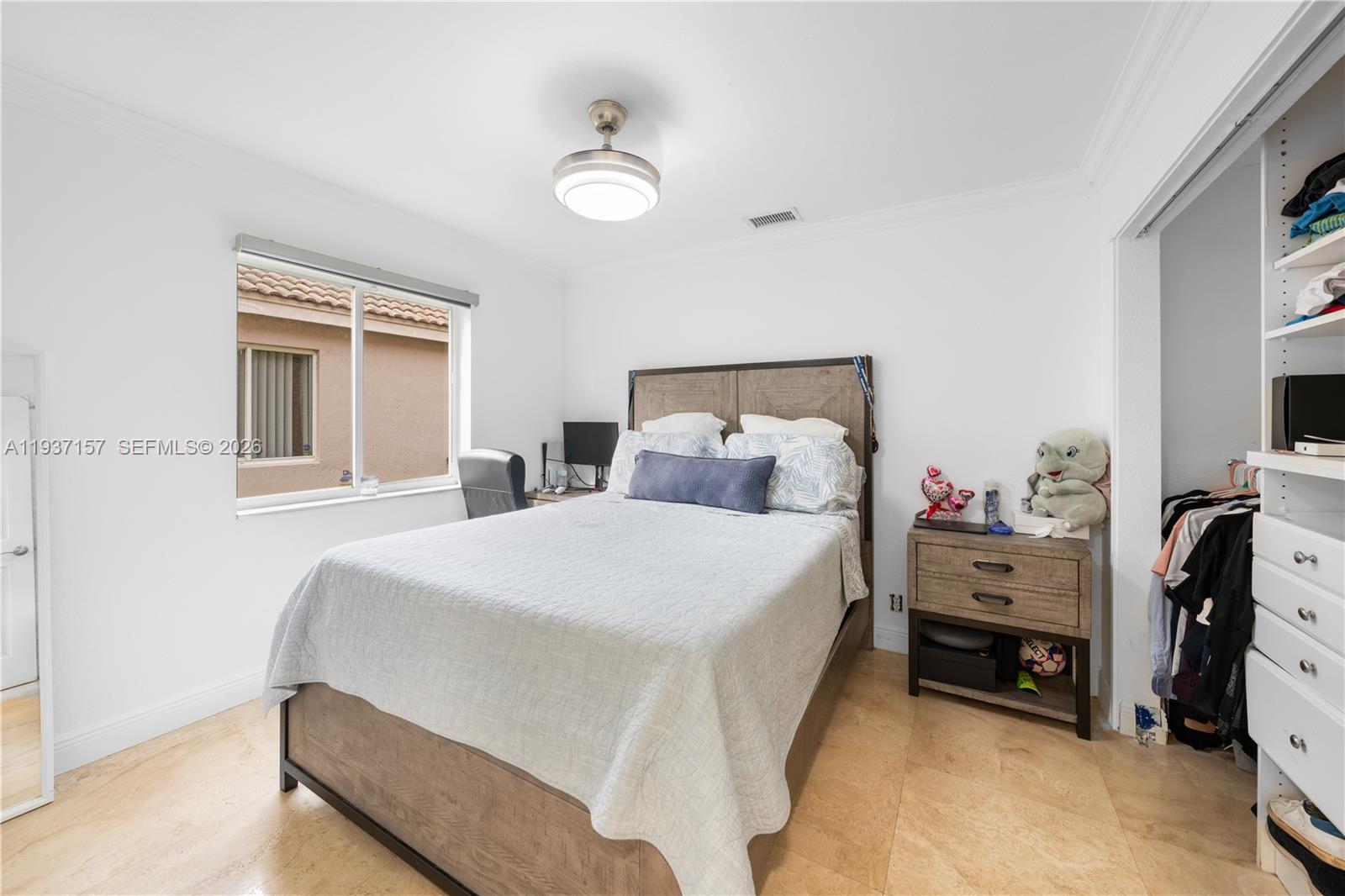 4361 Mahogany Ridge Drive Weston, FL 33331 - Photo 38 of 47 a bedroom with a bed and a window