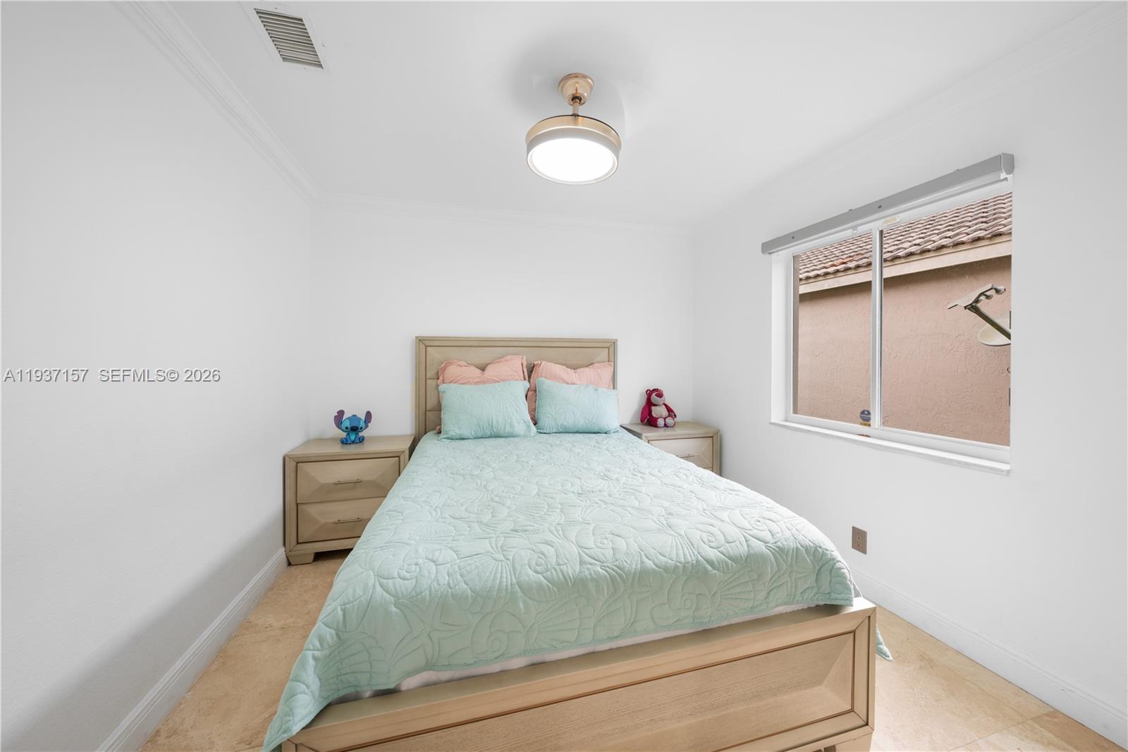 4361 Mahogany Ridge Drive Weston, FL 33331 - Photo 39 of 47 a bedroom with a bed and a window