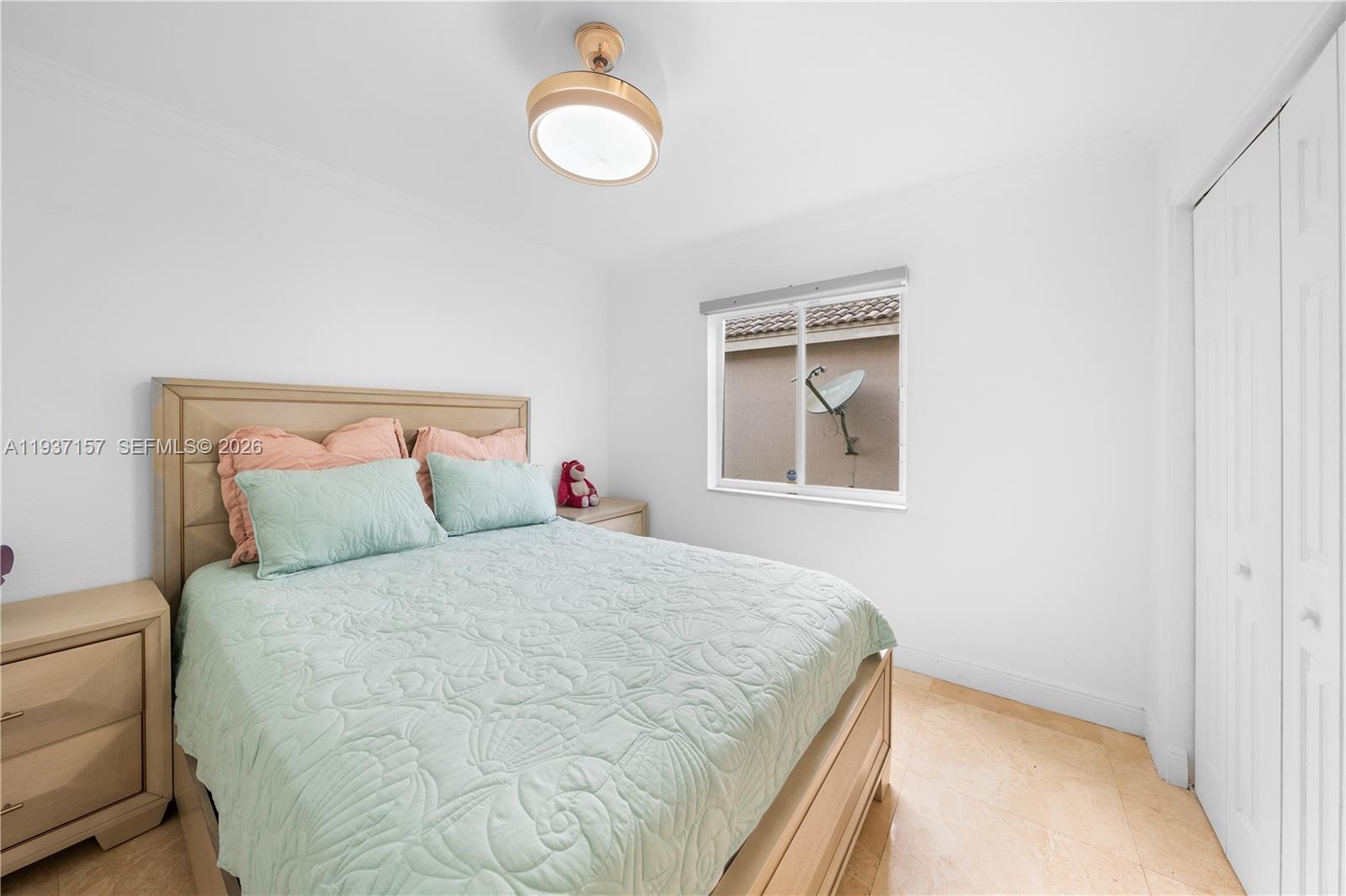 4361 Mahogany Ridge Drive Weston, FL 33331 - Photo 40 of 47 a bedroom with a bed and a window