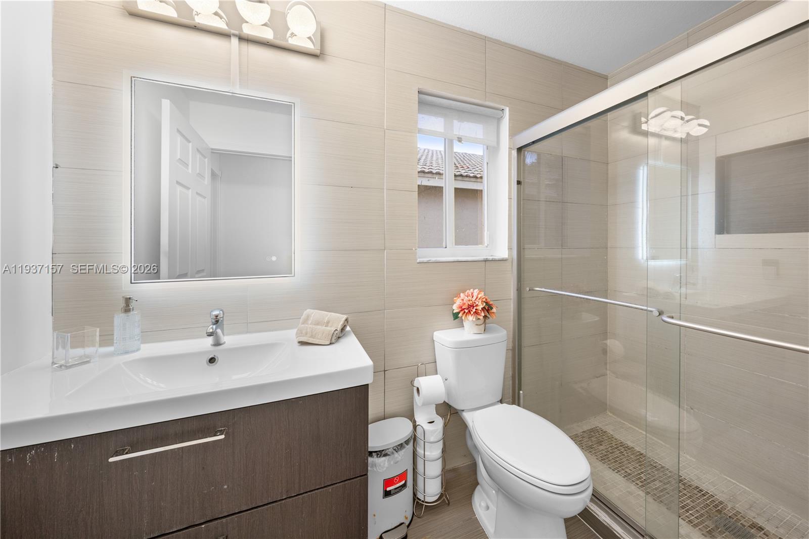 4361 Mahogany Ridge Drive Weston, FL 33331 - Photo 42 of 47 a bathroom with a sink toilet and shower