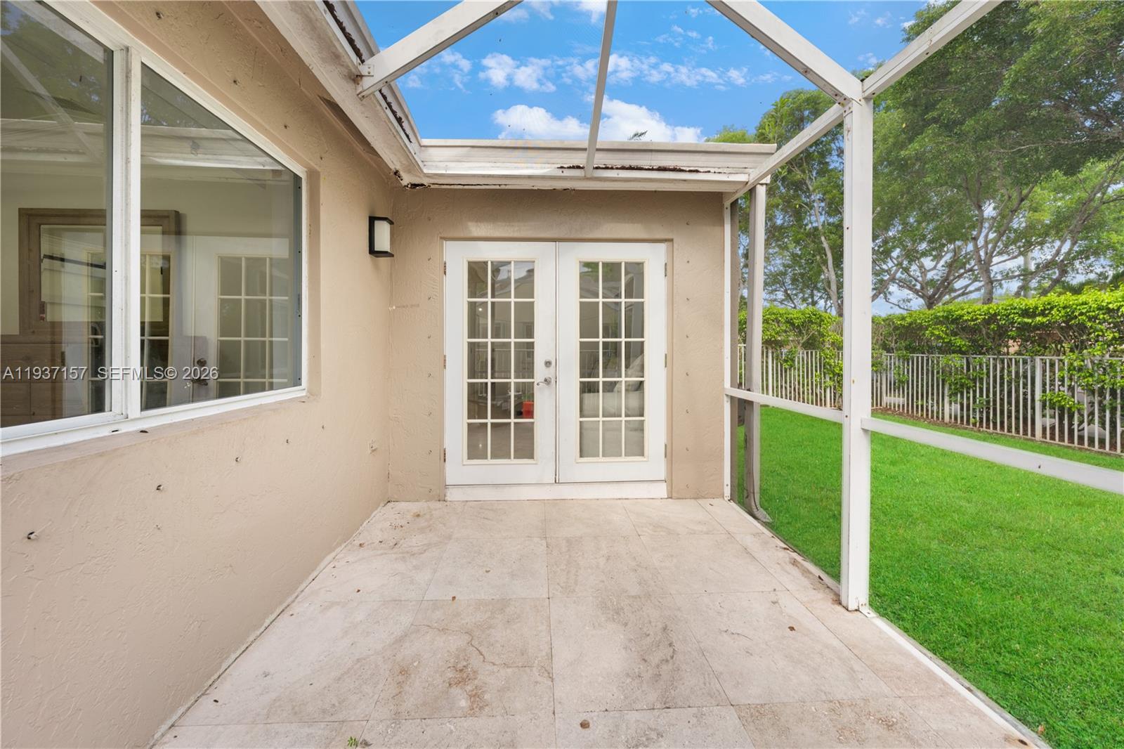 4361 Mahogany Ridge Drive Weston, FL 33331 - Photo 45 of 47 a view of a house with a large window and wooden fence