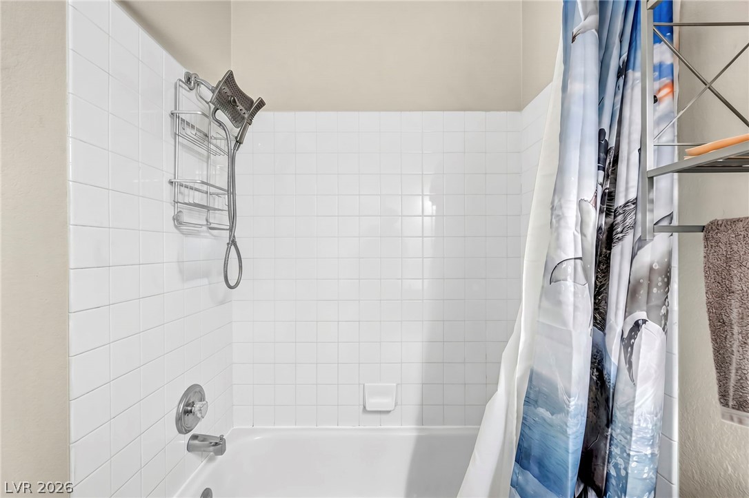 1234 Sunfire Street Henderson, NV 89014 - Photo 17 of 40 A well-maintained tub-shower combination offers daily comfort and convenience.
