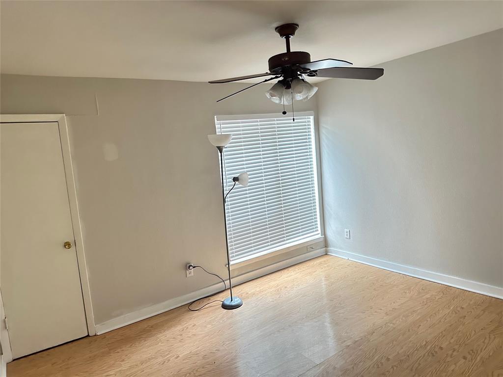 Undisclosed Address Dallas, TX 75220 - Photo 16 of 22 a view of an empty room with wooden floor