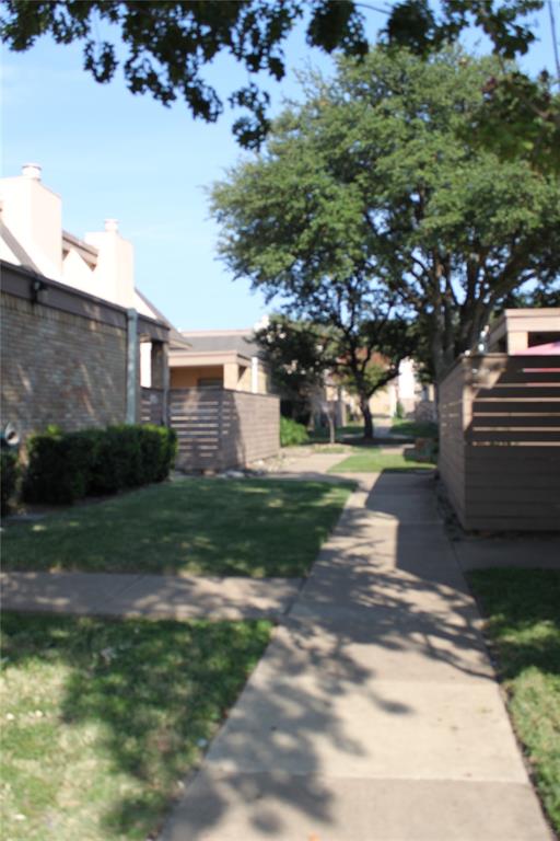 Undisclosed Address Dallas, TX 75220 - Photo 18 of 22 a view of a yard with plants and a large tree