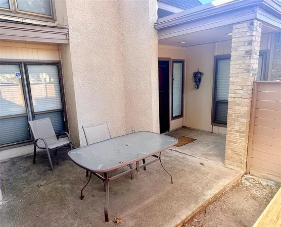 a view of a livingroom with furniture and a window
