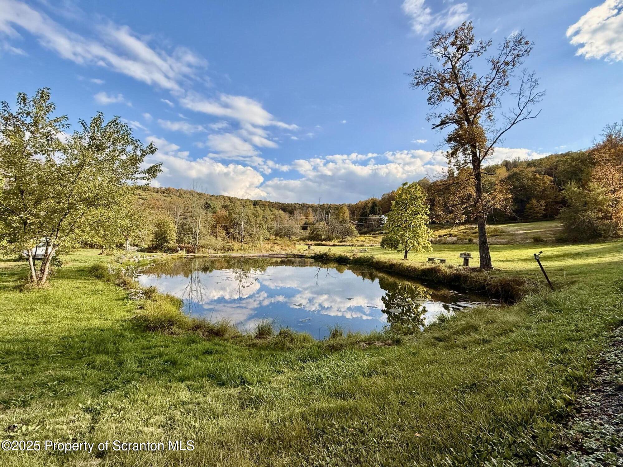 130 Fisk Mill Road Montrose, PA 18801 - Photo 18 of 31 a view of a lake with houses