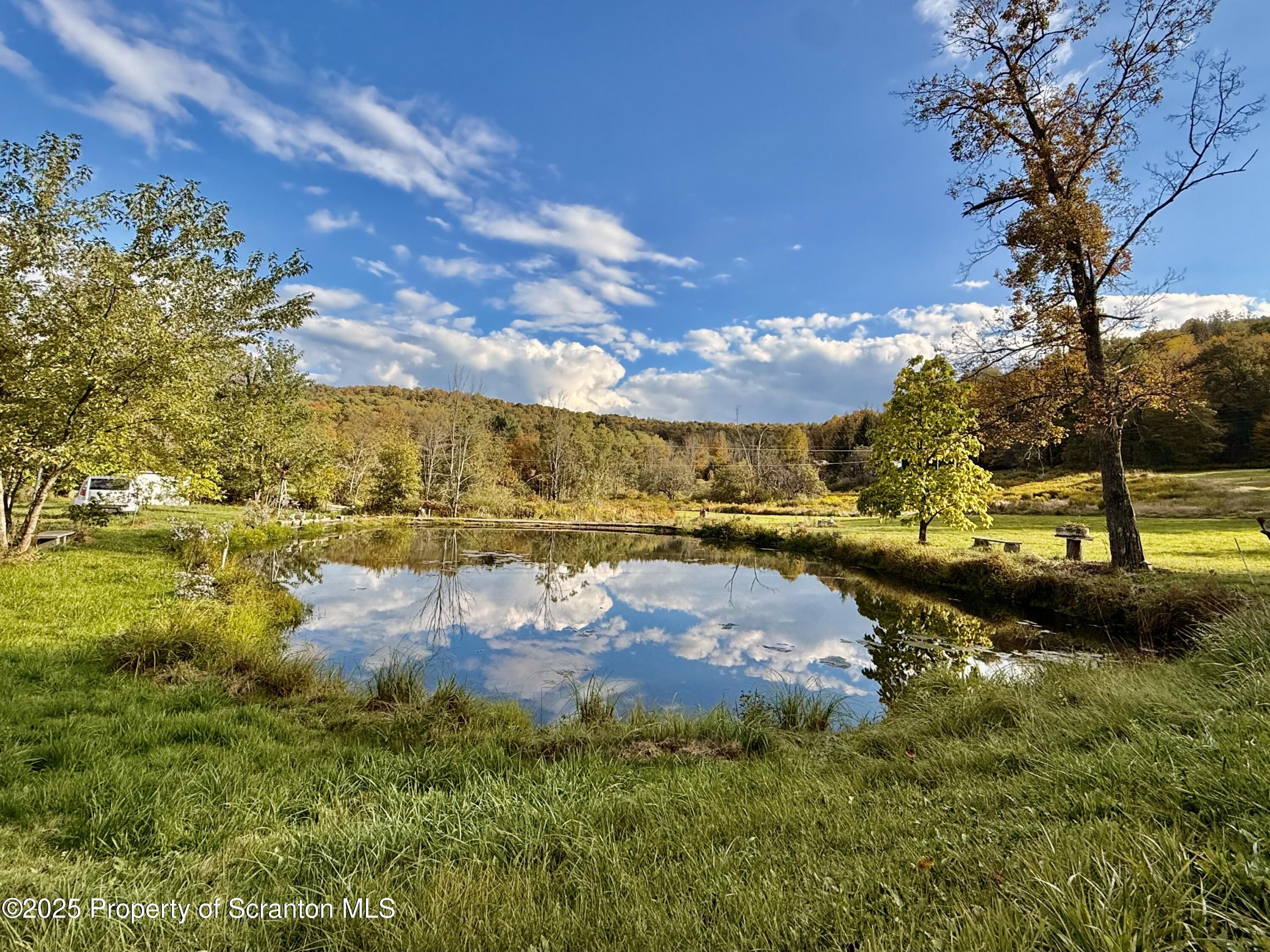 130 Fisk Mill Road Montrose, PA 18801 - Photo 2 of 31 a view of a lake with houses
