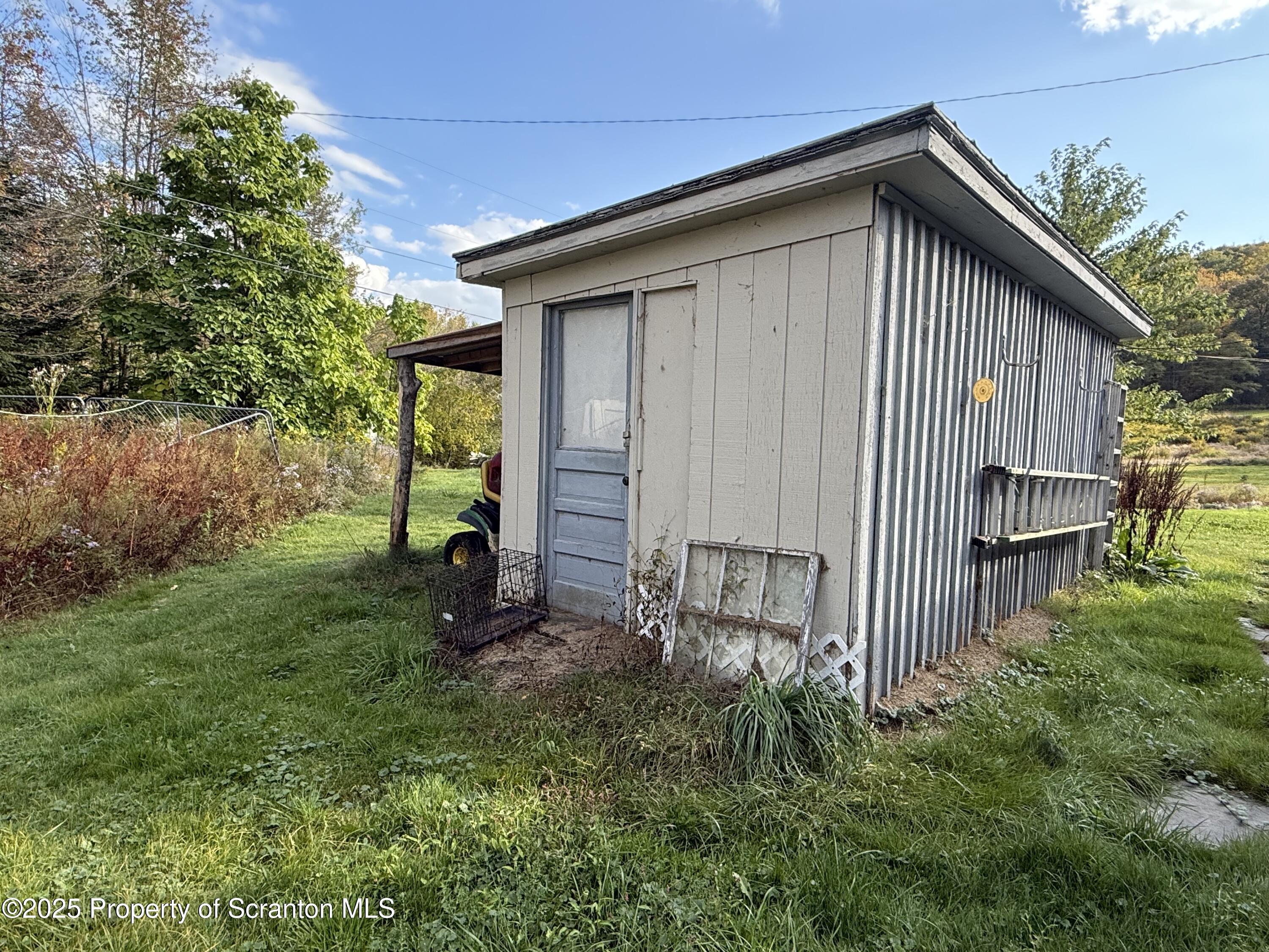 130 Fisk Mill Road Montrose, PA 18801 - Photo 25 of 31 a front view of a house with garden