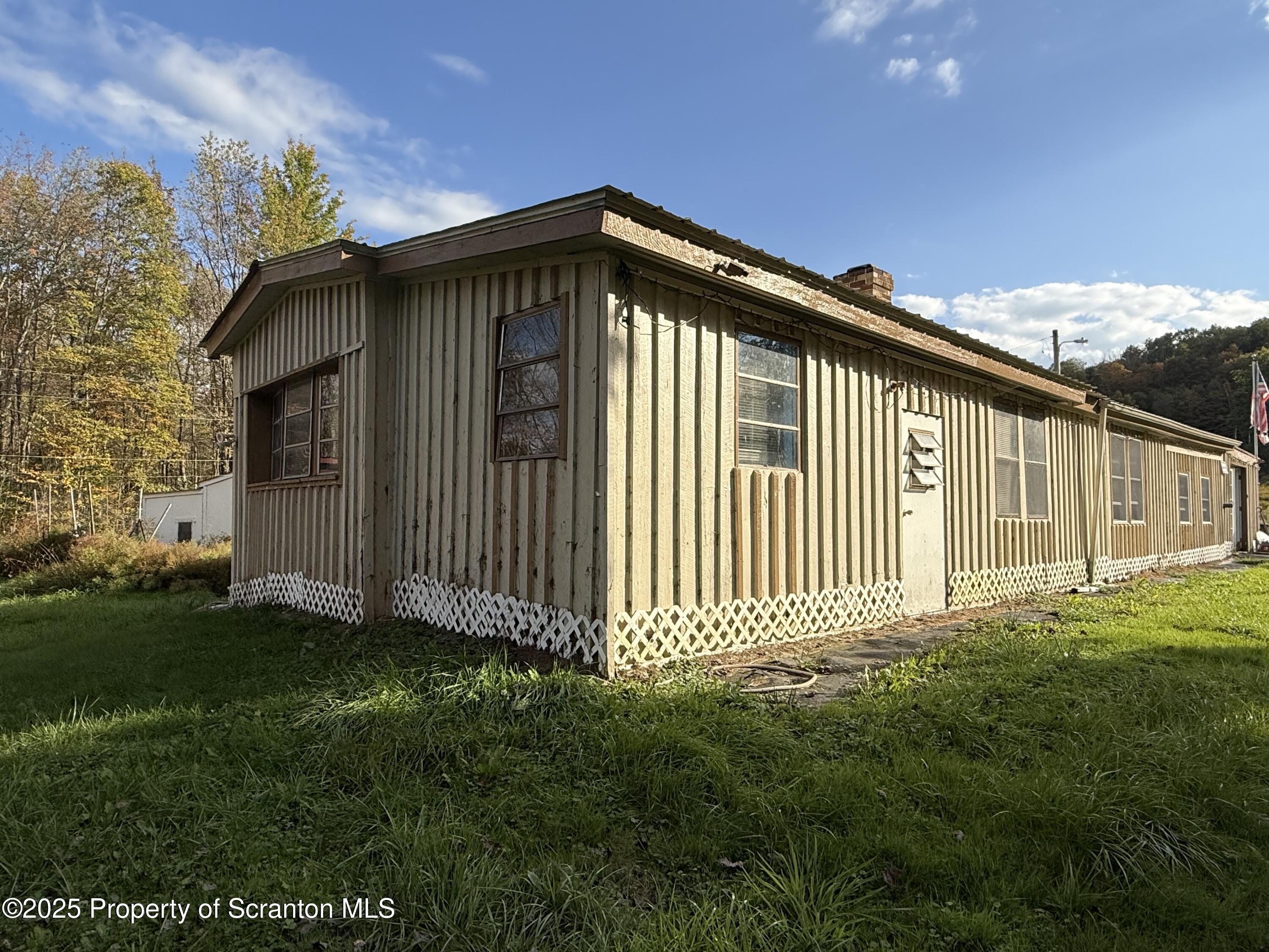 130 Fisk Mill Road Montrose, PA 18801 - Photo 4 of 31 a front view of a house with garden