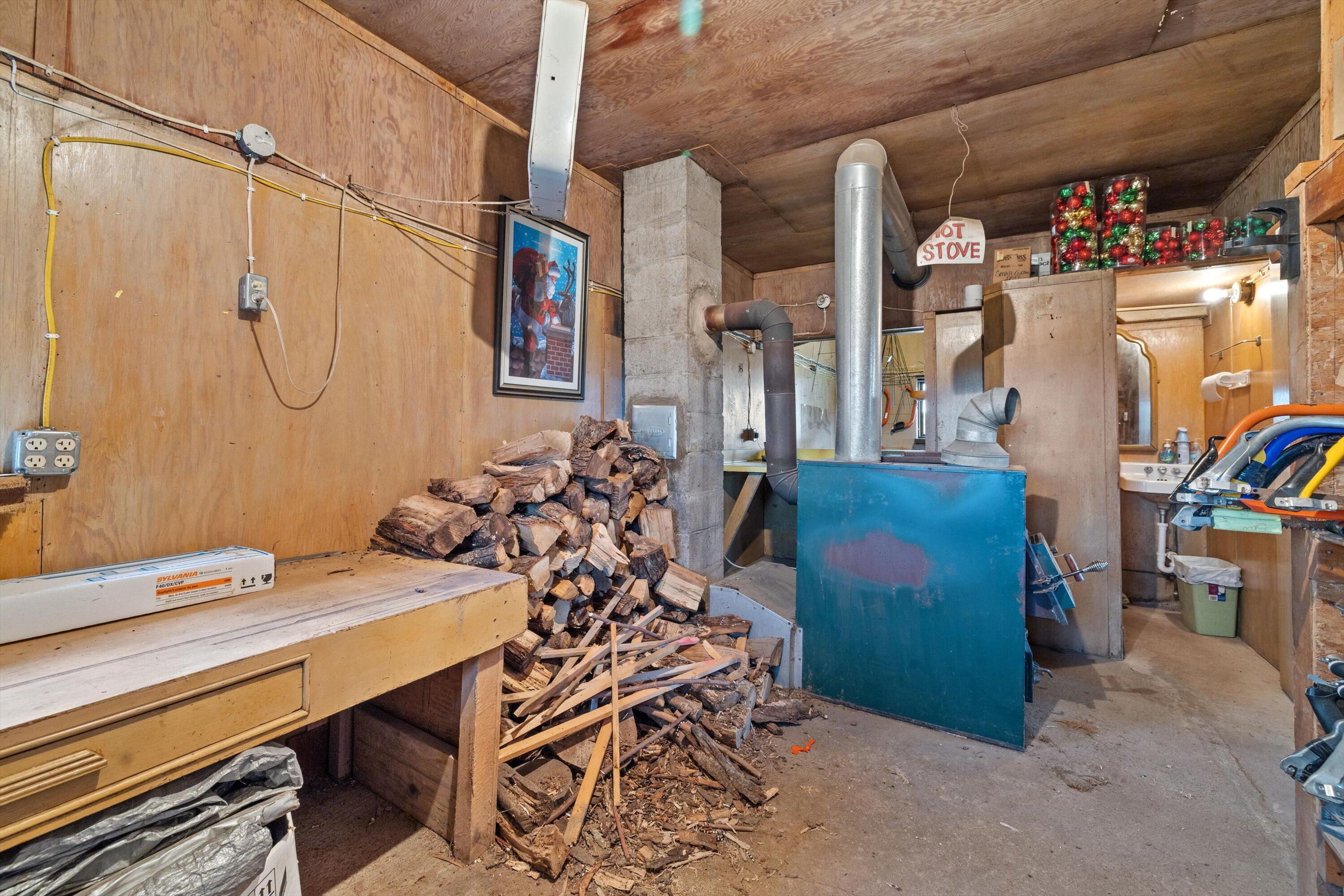 N9171 Nelson Road La Grange, WI 53120 - Photo 52 of 62 Bathroom and wood burning stove