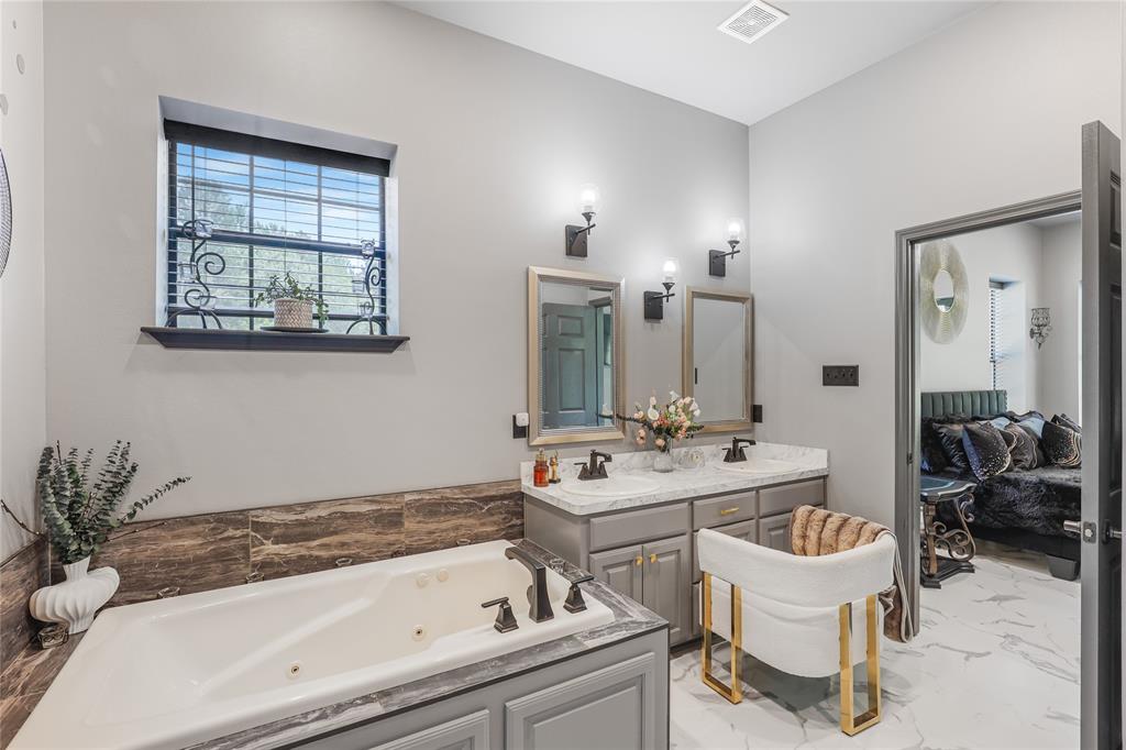 1373 George Ephram Cord 166 Road Overton, TX 75684 - Photo 31 of 40 Dual vanity with undermount sinks and wall-mounted sconces