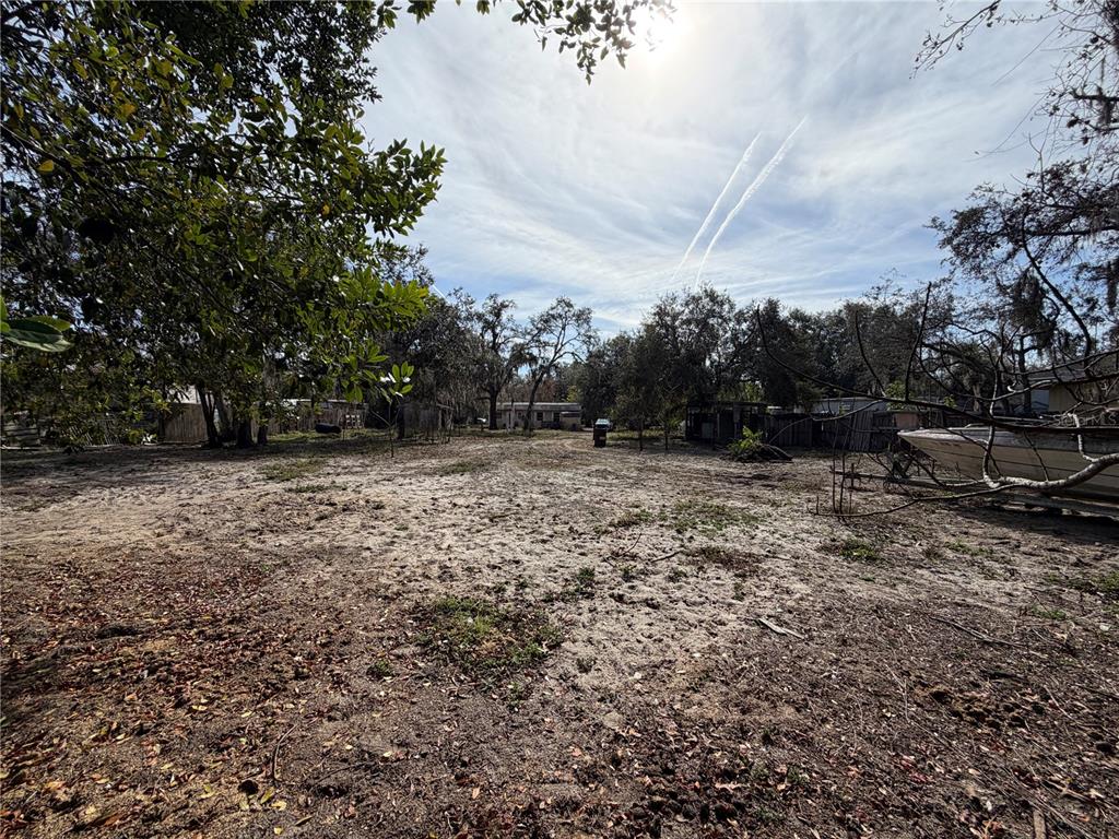 10711 Jacamar Drive New Port Richey, FL 34654 - Photo 12 of 19 a view of outdoor space with deck and yard