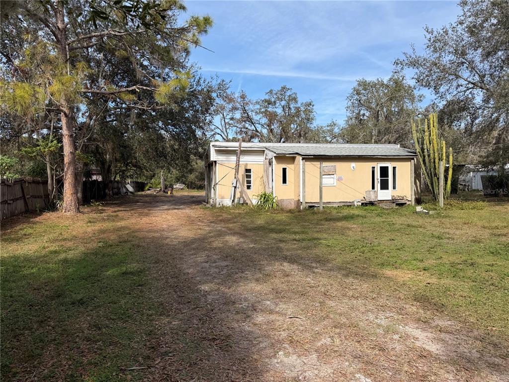 10711 Jacamar Drive New Port Richey, FL 34654 - Photo 18 of 19 a front view of a house with a yard