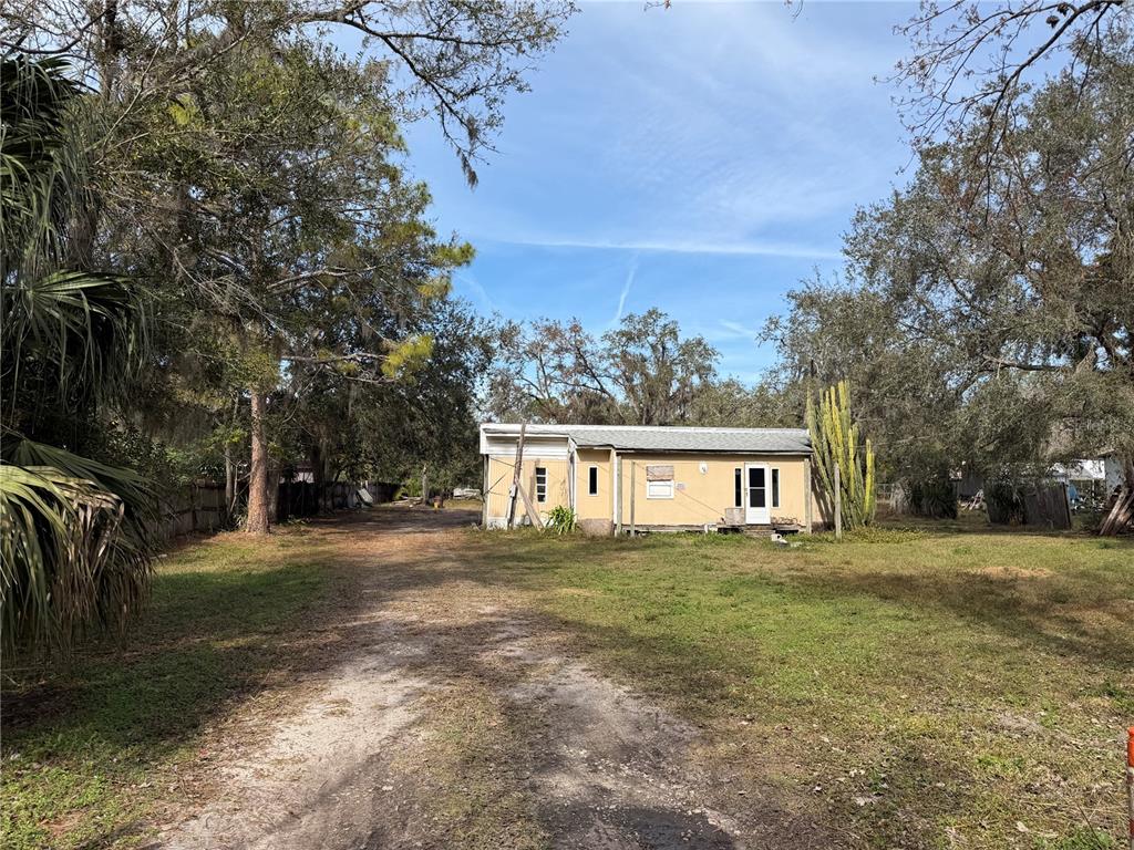 10711 Jacamar Drive New Port Richey, FL 34654 - Photo 4 of 19 a front view of a house with a yard