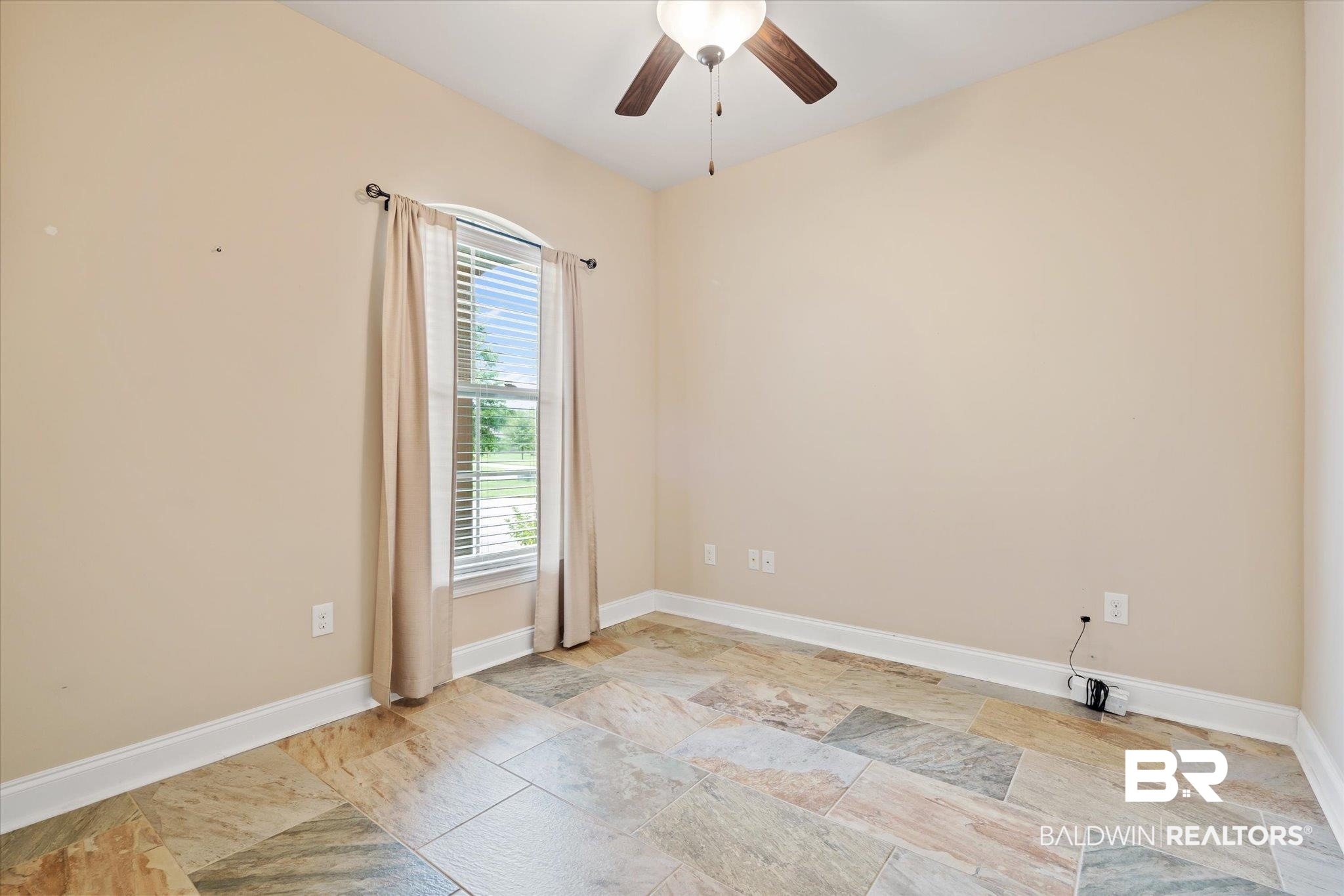 423 Breckin Drive Fairhope, AL 36532 - Photo 25 of 31 Empty room with a wealth of natural light and ceiling fan