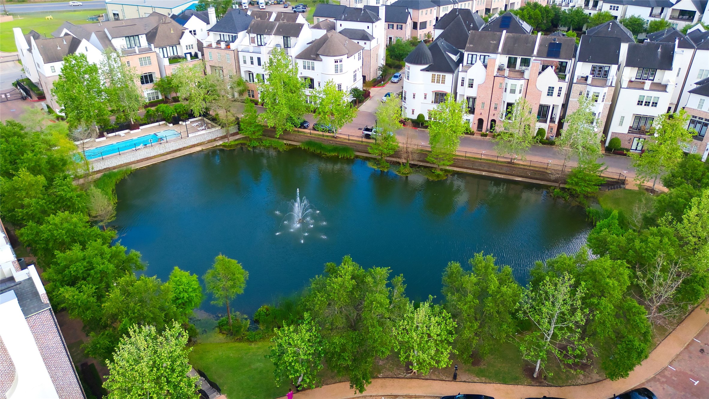 2029 Fannin Station North Houston, TX 77045 - Photo 1 of 14 a view of a lake with a house