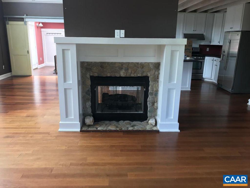 8497 Laurel Road Shipman, VA 22971 - Photo 13 of 37 a living room with a fireplace