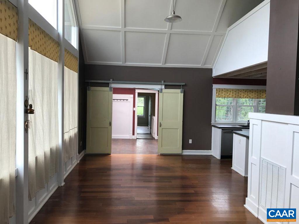 8497 Laurel Road Shipman, VA 22971 - Photo 14 of 37 a view of a hallway with wooden floor and windows