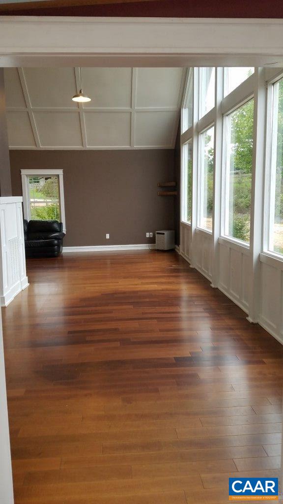 8497 Laurel Road Shipman, VA 22971 - Photo 15 of 37 a view of an empty room with window and wooden floor