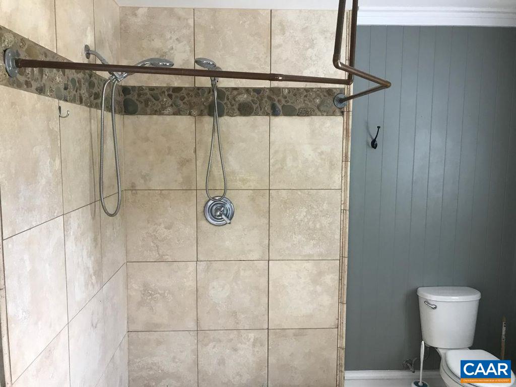 8497 Laurel Road Shipman, VA 22971 - Photo 18 of 37 a bathroom with a shower and a toilet
