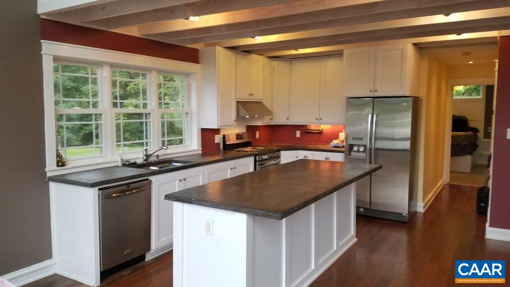 8497 Laurel Road Shipman, VA 22971 - Photo 2 of 37 a kitchen with stainless steel appliances granite countertop a sink a stove and a refrigerator