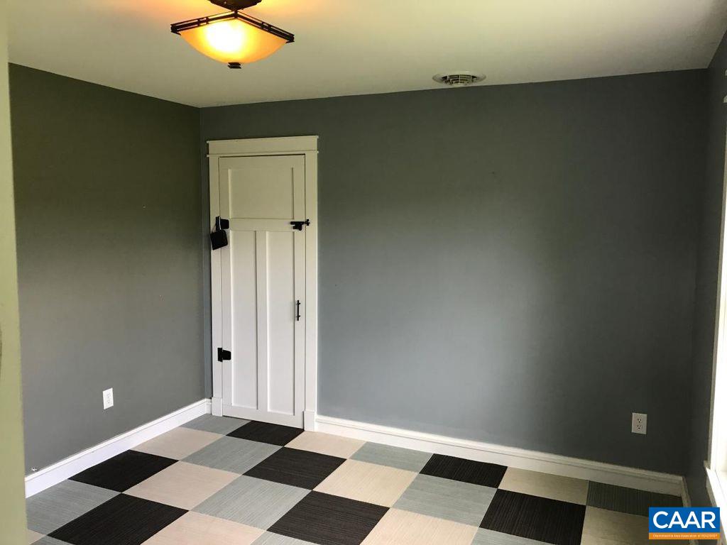8497 Laurel Road Shipman, VA 22971 - Photo 21 of 37 a view of a livingroom with a black and white checkered floor