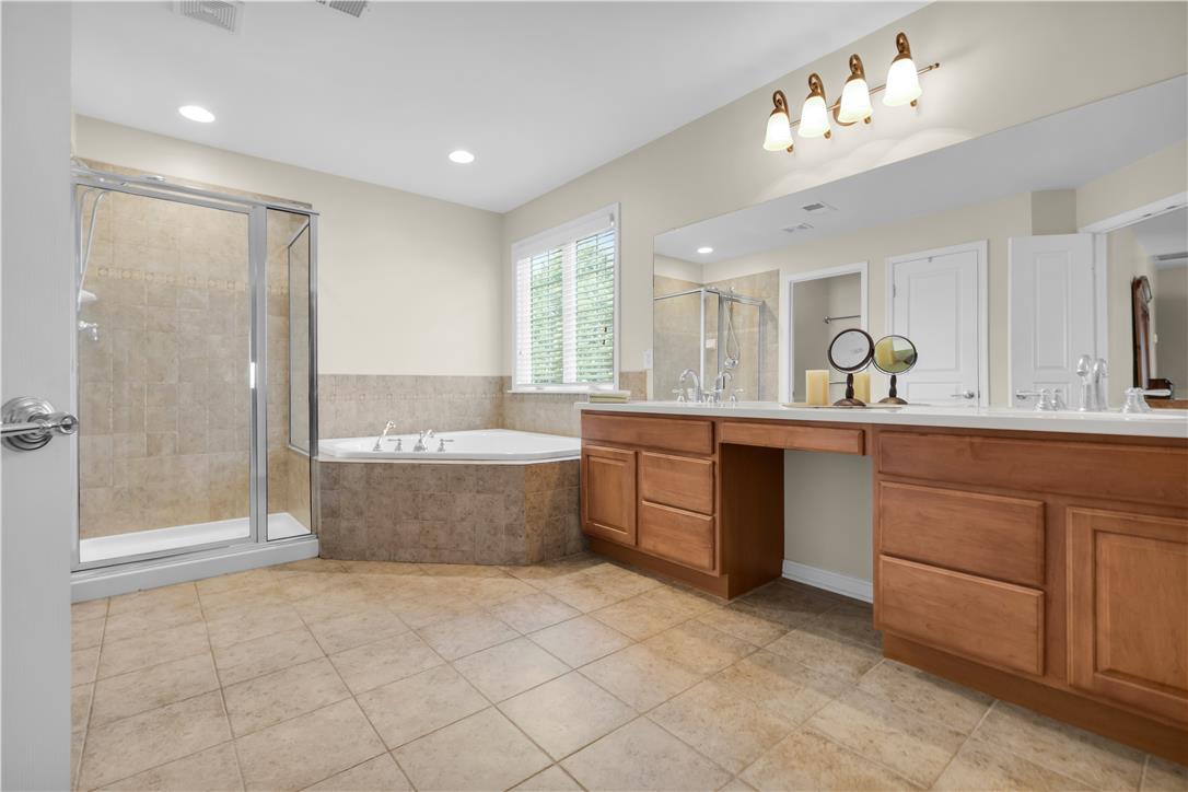 1709 Travers Road Breinigsville, PA 18031 - Photo 30 of 55 Luxurious bathing retreat featuring a spacious corner tub and separate glass-enclosed shower.