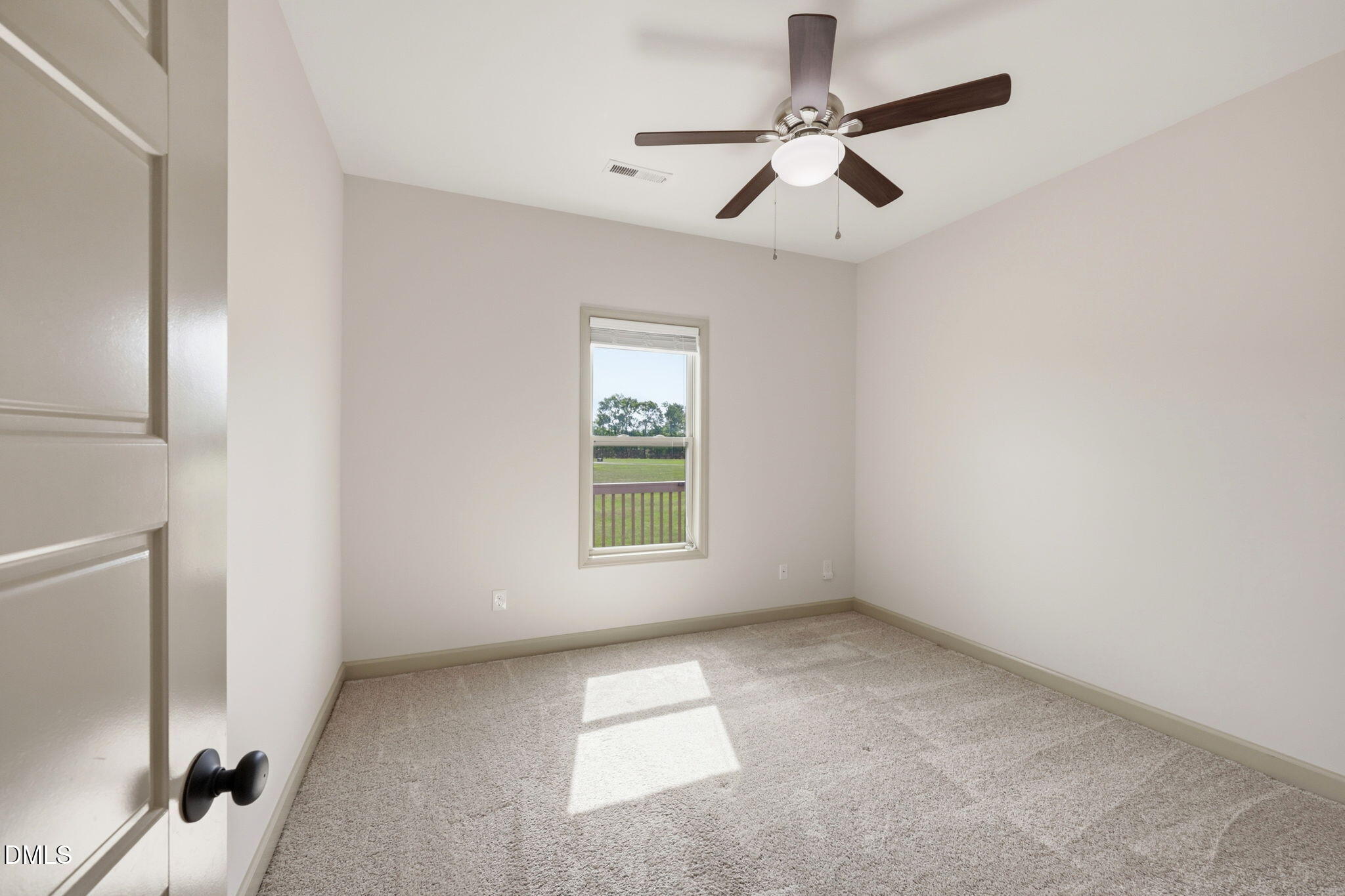 3587 Hannah Creek Road Benson, NC 27504 - Photo 23 of 43 a view of an empty room with a window