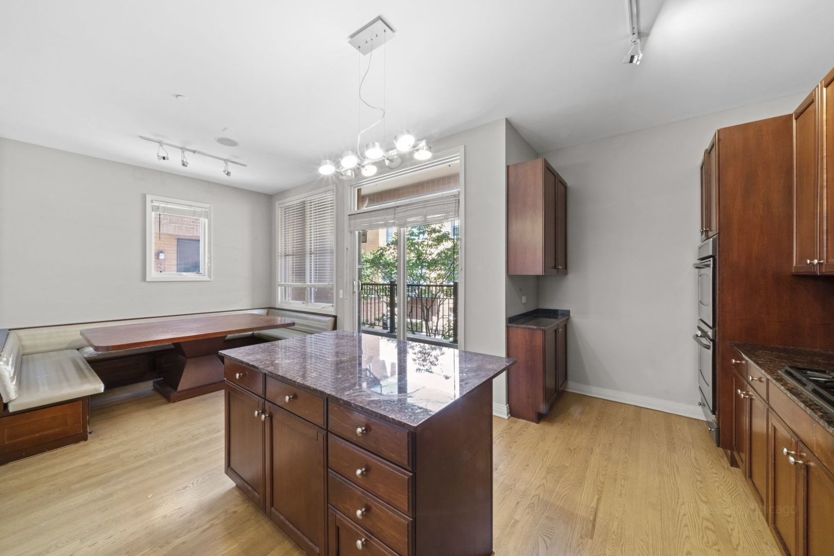 1137 West Monroe Street, Unit 17 Chicago, IL 60607 - Photo 11 of 41 a kitchen with sink refrigerator and window