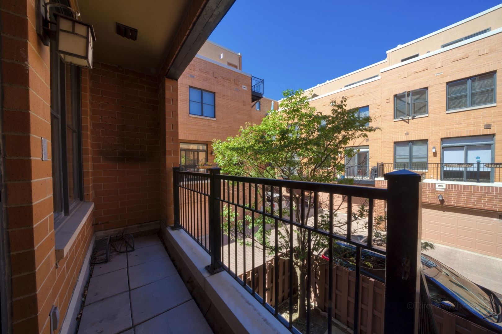 1137 West Monroe Street, Unit 17 Chicago, IL 60607 - Photo 13 of 41 a view of a balcony with wooden floor
