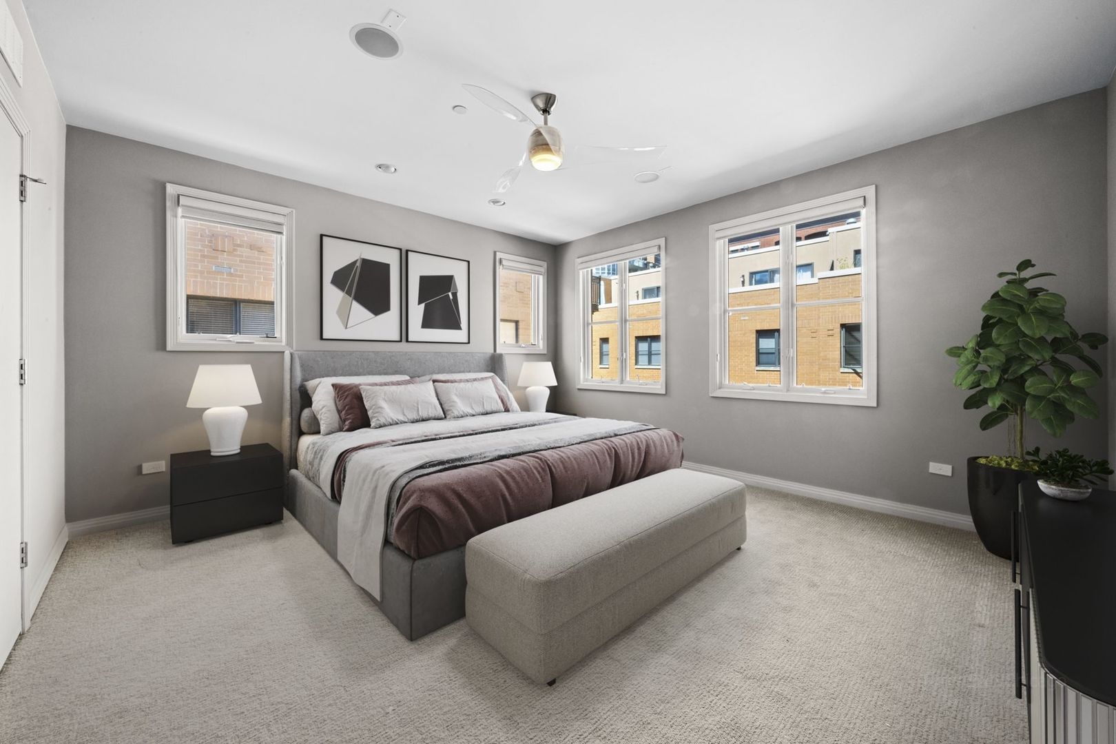 1137 West Monroe Street, Unit 17 Chicago, IL 60607 - Photo 14 of 41 a spacious bedroom with a bed and a potted plant