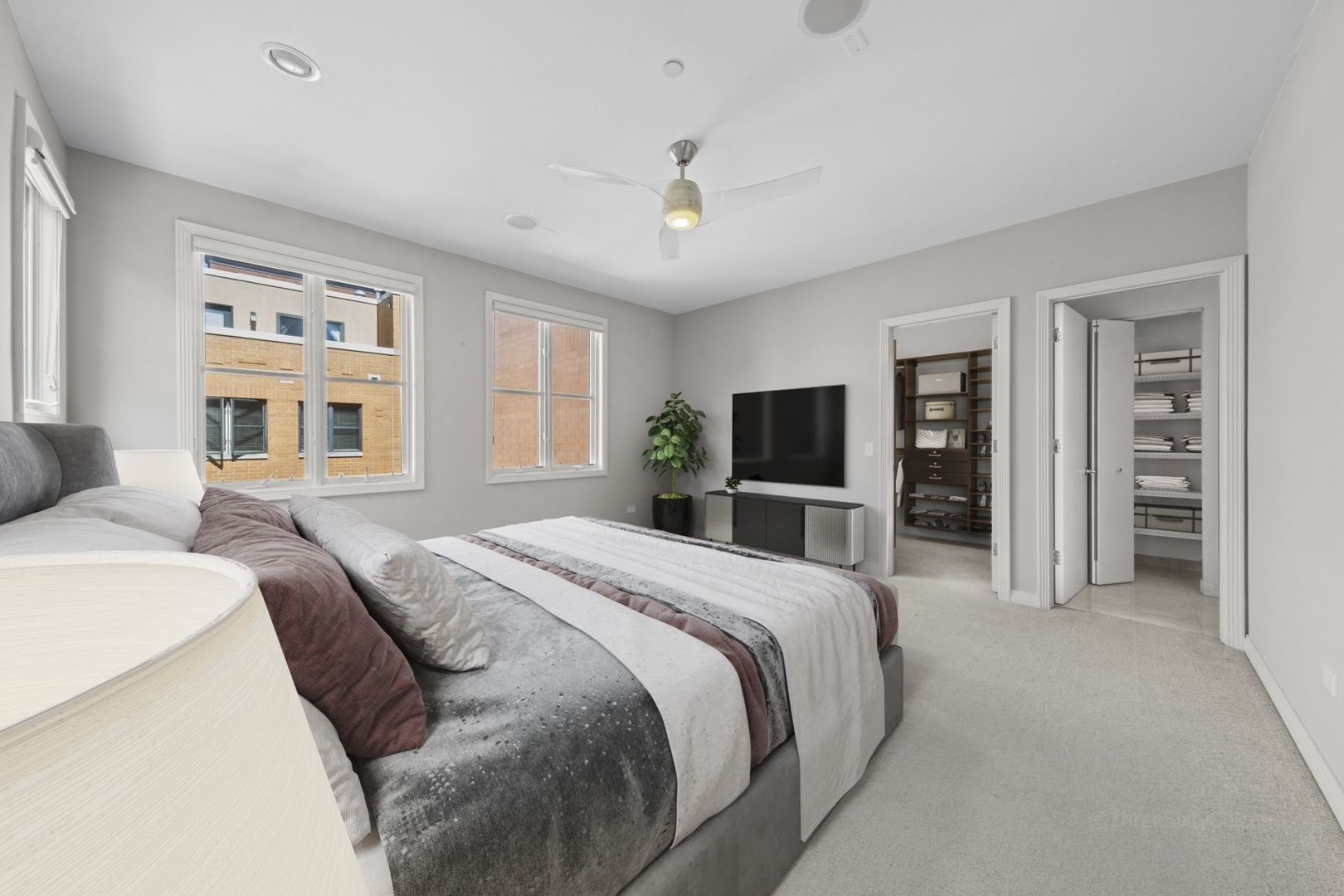 1137 West Monroe Street, Unit 17 Chicago, IL 60607 - Photo 16 of 41 a spacious bedroom with a large bed and a flat tv screen