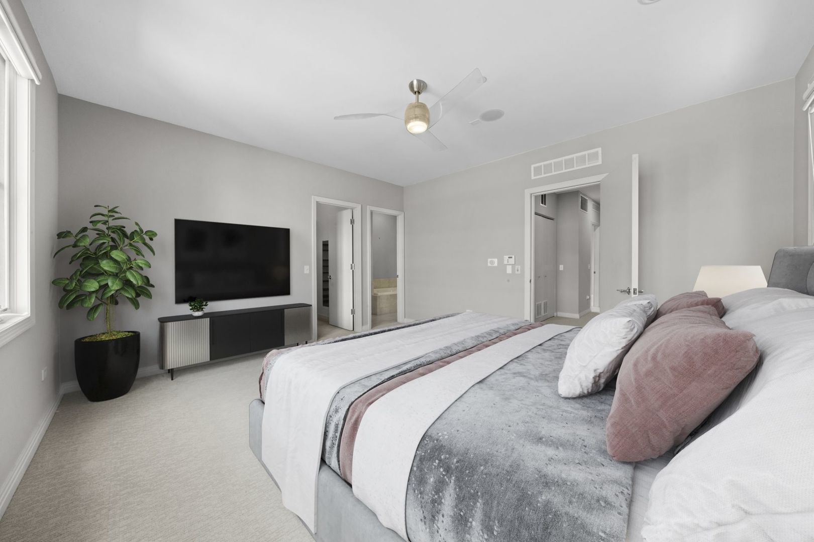 1137 West Monroe Street, Unit 17 Chicago, IL 60607 - Photo 17 of 41 a bedroom with a balcony a bed and a television