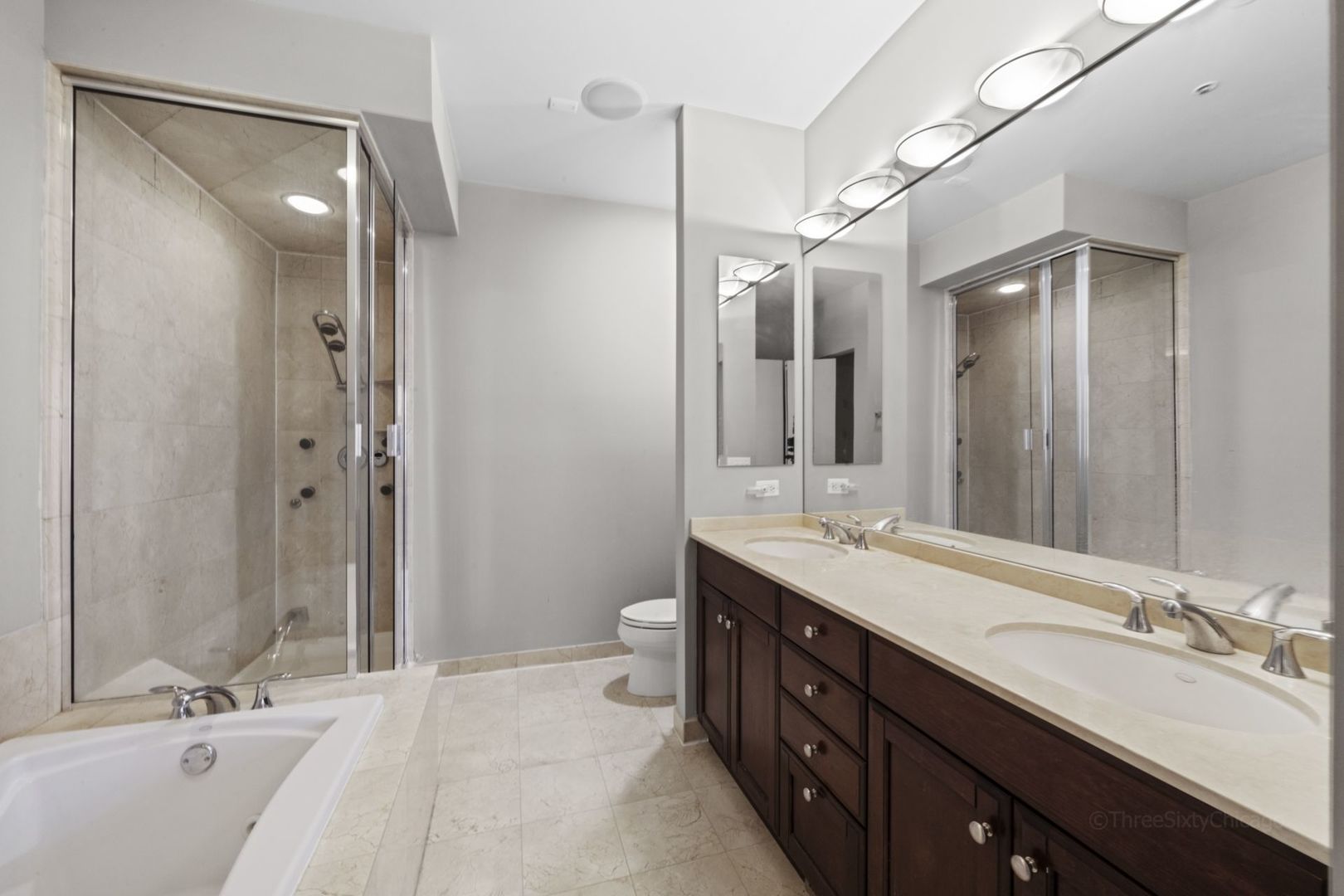 1137 West Monroe Street, Unit 17 Chicago, IL 60607 - Photo 18 of 41 a bathroom with a double vanity sink mirror double and shower