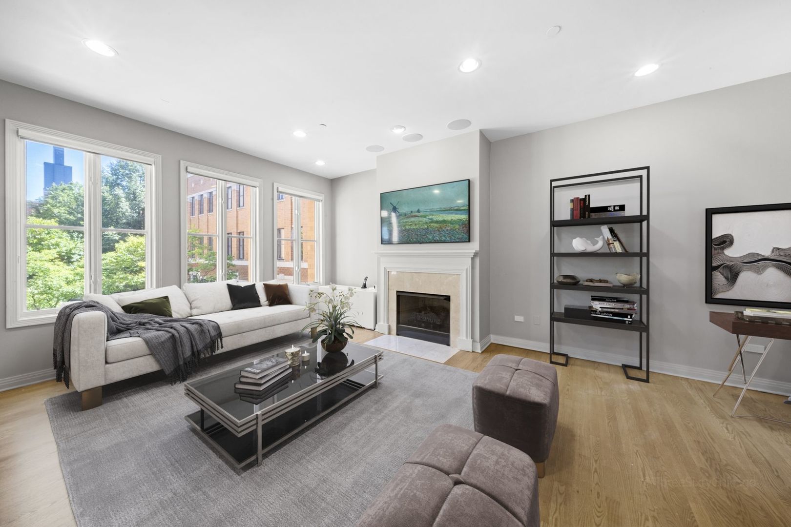 1137 West Monroe Street, Unit 17 Chicago, IL 60607 - Photo 2 of 41 a living room with furniture a flat screen tv and a fireplace
