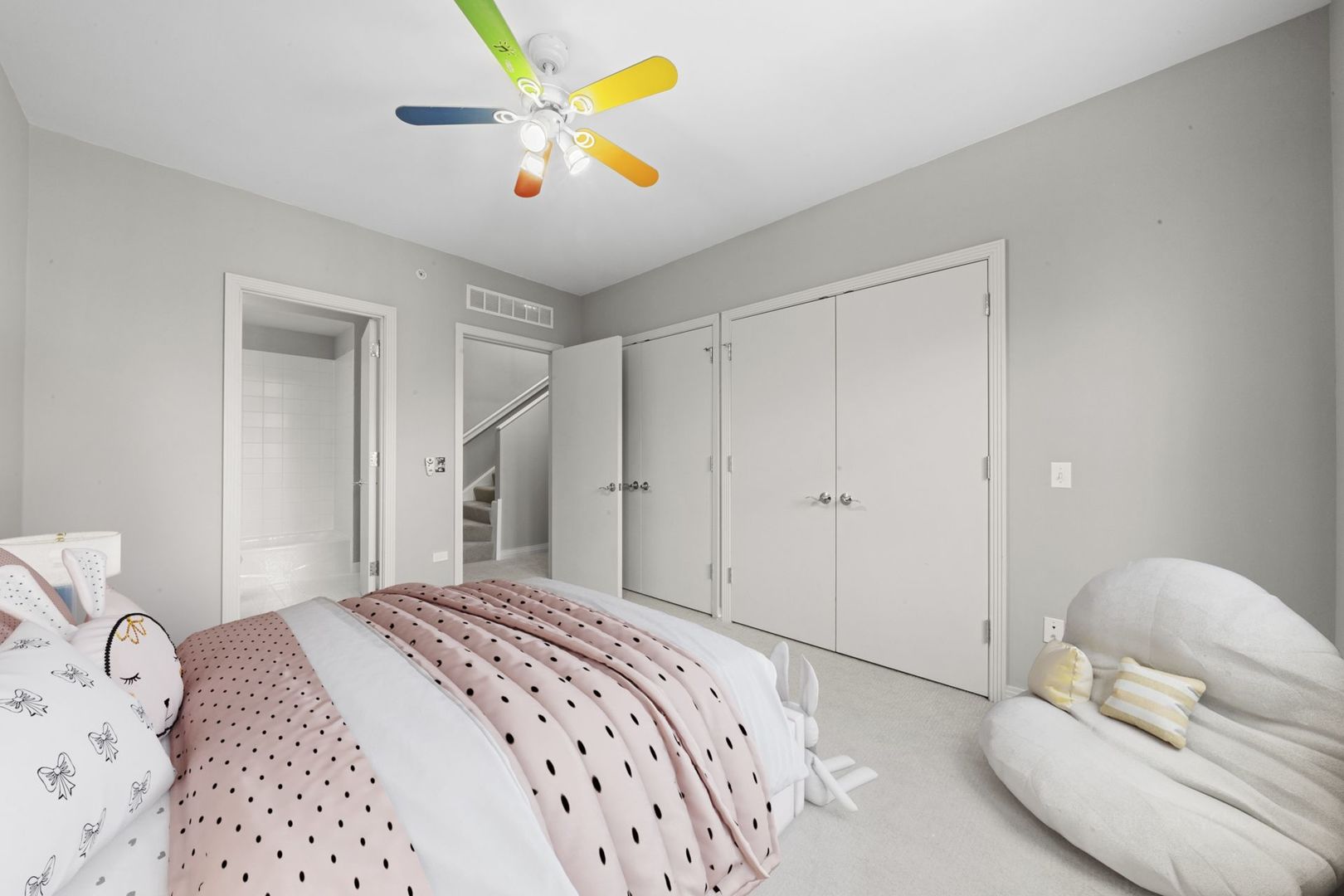 1137 West Monroe Street, Unit 17 Chicago, IL 60607 - Photo 21 of 41 a bedroom with a bed and a chandelier