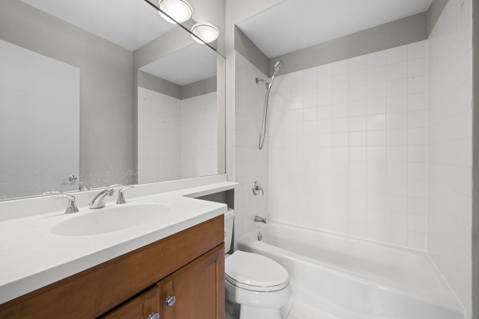 1137 West Monroe Street, Unit 17 Chicago, IL 60607 - Photo 22 of 41 a bathroom with a sink a toilet and shower