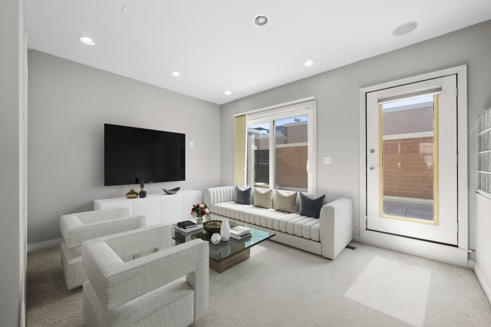 1137 West Monroe Street, Unit 17 Chicago, IL 60607 - Photo 23 of 41 a living room with furniture and a flat screen tv