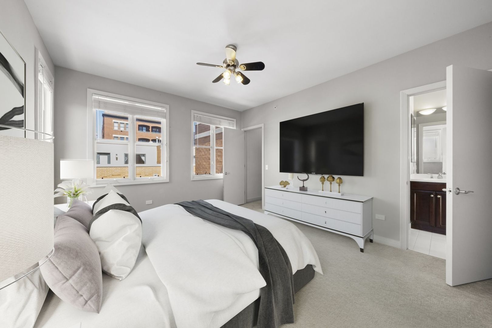 1137 West Monroe Street, Unit 17 Chicago, IL 60607 - Photo 28 of 41 a bedroom with a bed and a flat screen tv