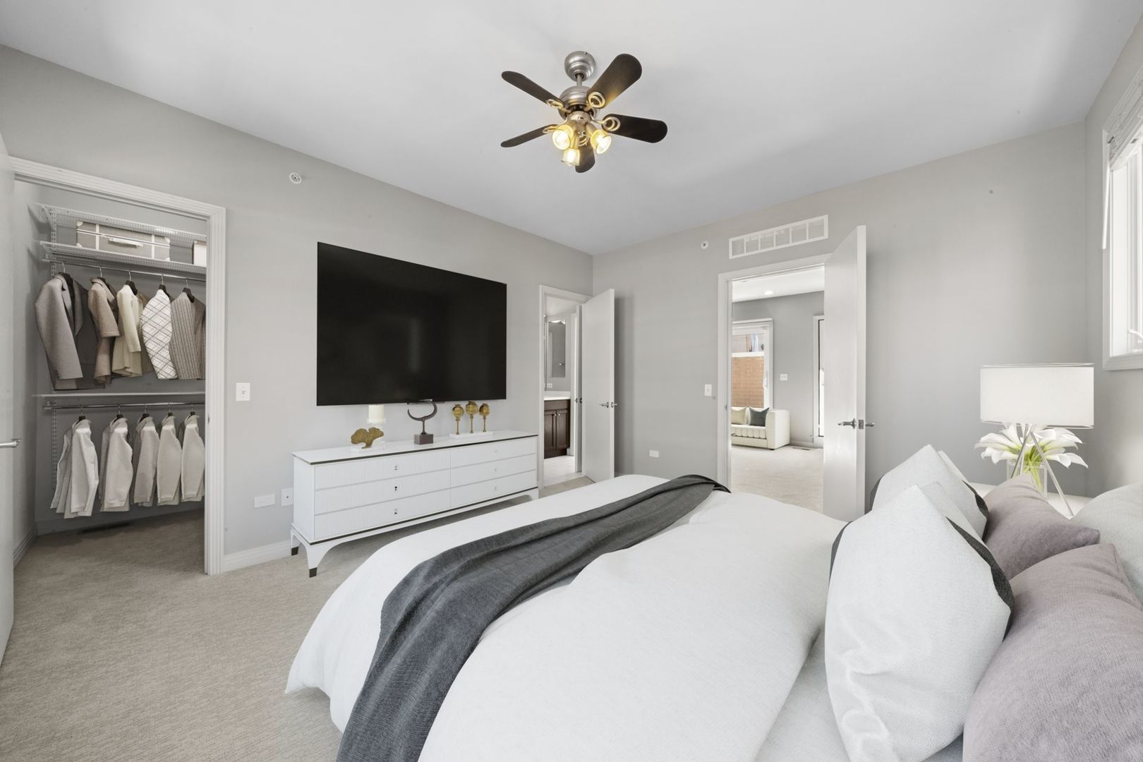 1137 West Monroe Street, Unit 17 Chicago, IL 60607 - Photo 29 of 41 a bedroom with a bed and a flat screen tv