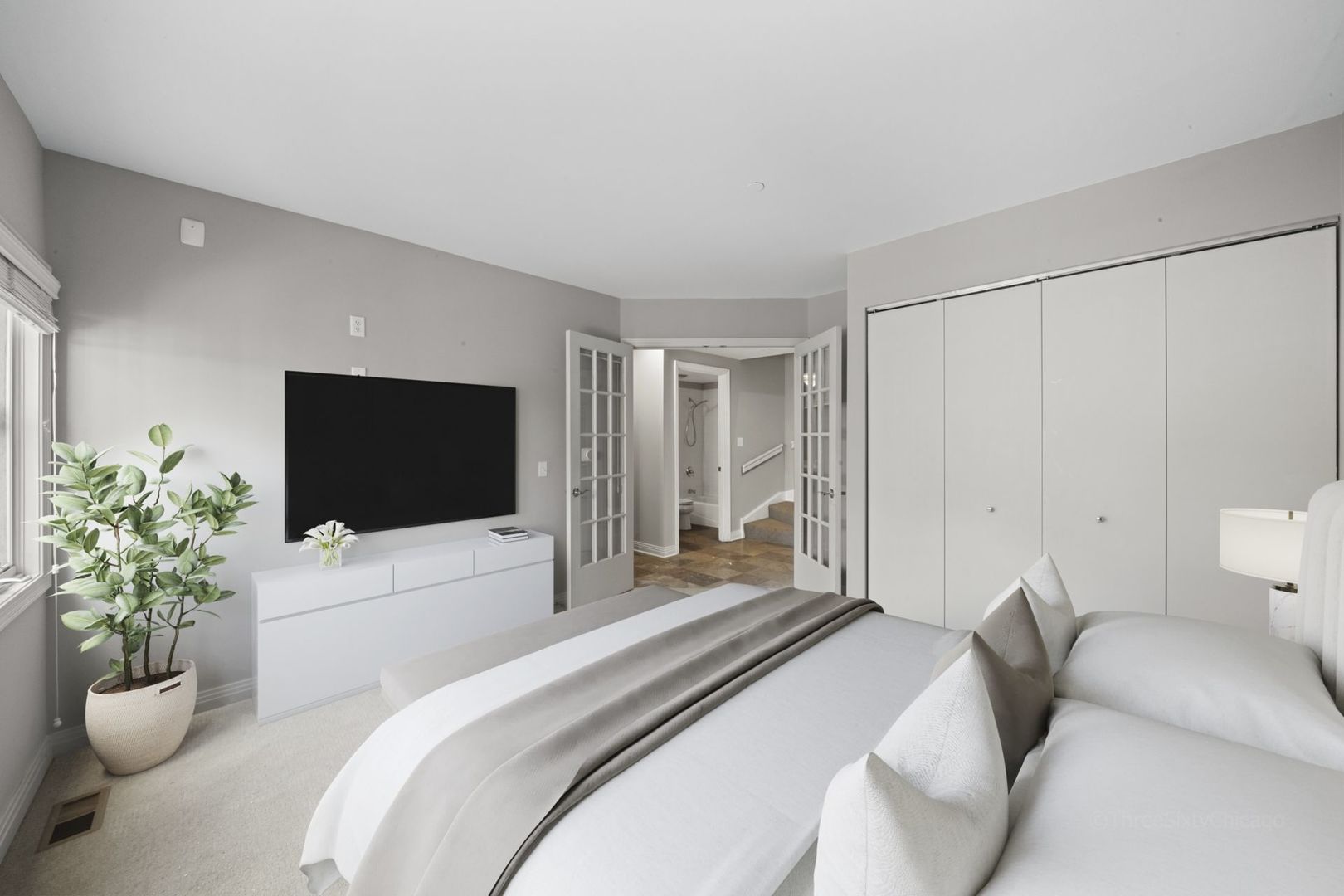 1137 West Monroe Street, Unit 17 Chicago, IL 60607 - Photo 32 of 41 a bedroom with a bed and a flat screen tv