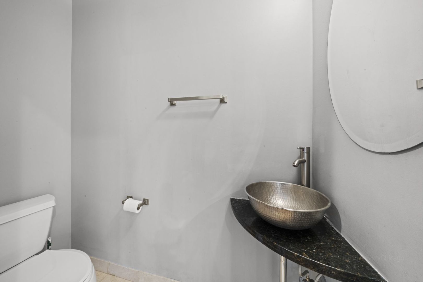 1137 West Monroe Street, Unit 17 Chicago, IL 60607 - Photo 35 of 41 a bathroom with a toilet and a sink