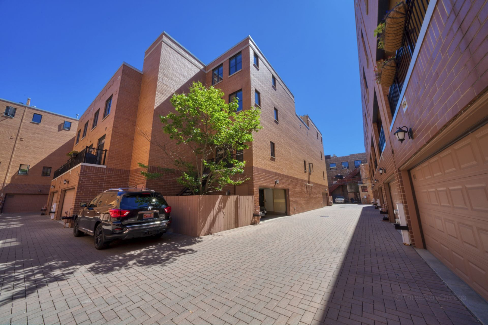 1137 West Monroe Street, Unit 17 Chicago, IL 60607 - Photo 37 of 41 a car parked in front of a house