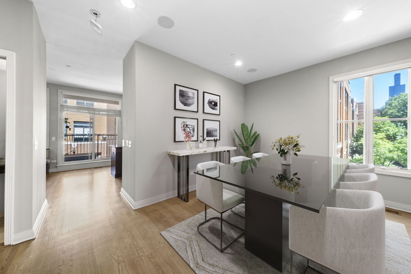 1137 West Monroe Street, Unit 17 Chicago, IL 60607 - Photo 8 of 41 a view of a workspace room with wooden floor and furniture