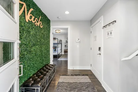a view of a entryway door with wooden floor