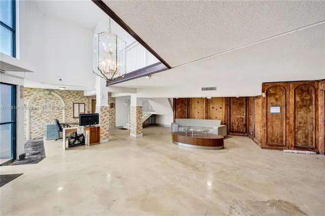 a view of a tall building next to a road